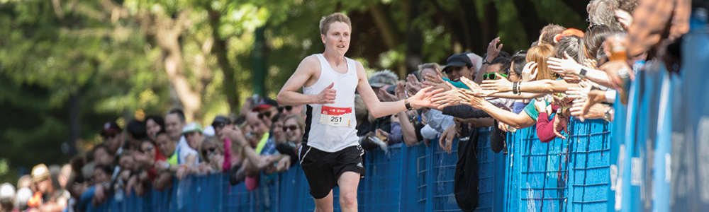 High fives. The community support, especially at the BMO Vancouver Marathon, is amazing! Thank you! Photo: Christopher Morris / RUNVAN®